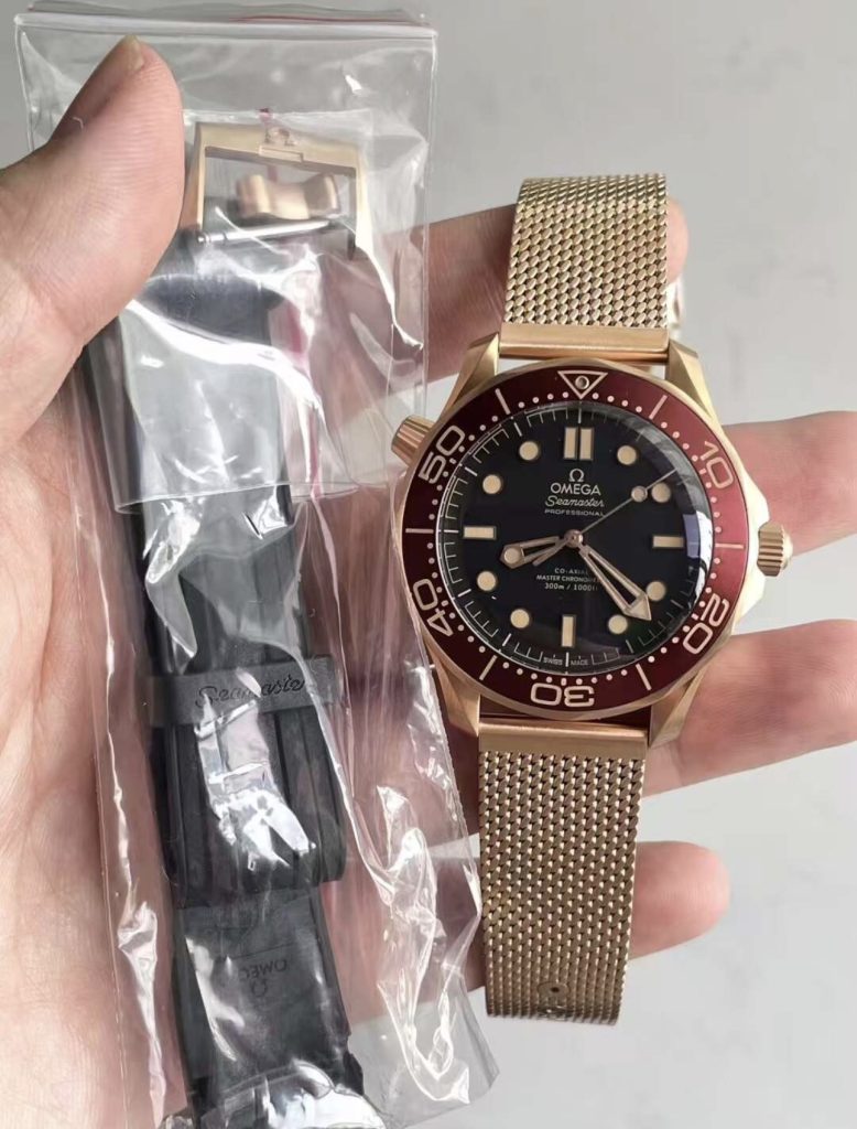 VSF Omega 300M 007 Bronze Gold package including the bonus black rubber strap and bronze buckle