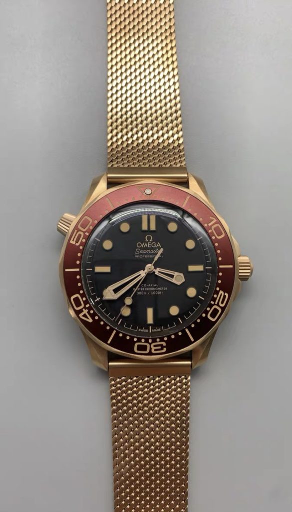 Front view of the VSF Omega 007 Bronze Gold featuring the Burgundy red dial and domed sapphire crystal