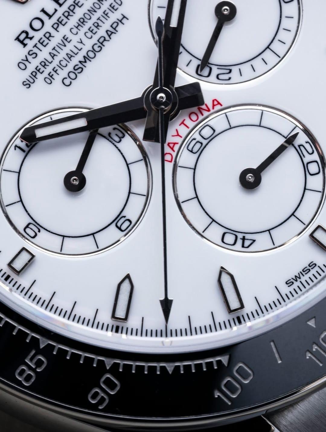 High-resolution macro shot of the VSF Daytona white dial, crisp red DAYTONA text, and sub-dials