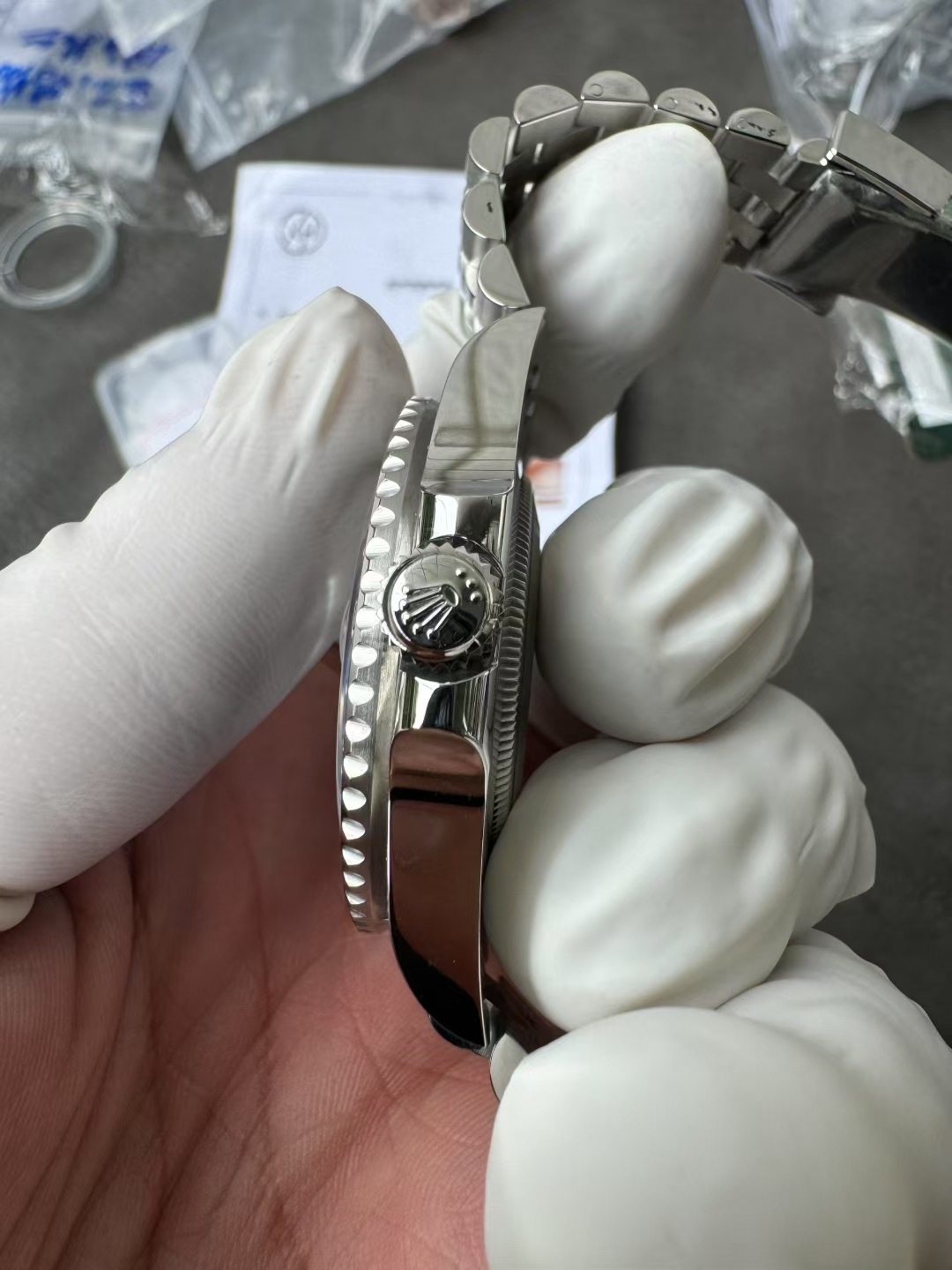 Side profile view of the VSF GMT-Master II case showing polished mid-case flanks and the Triplock winding crown
