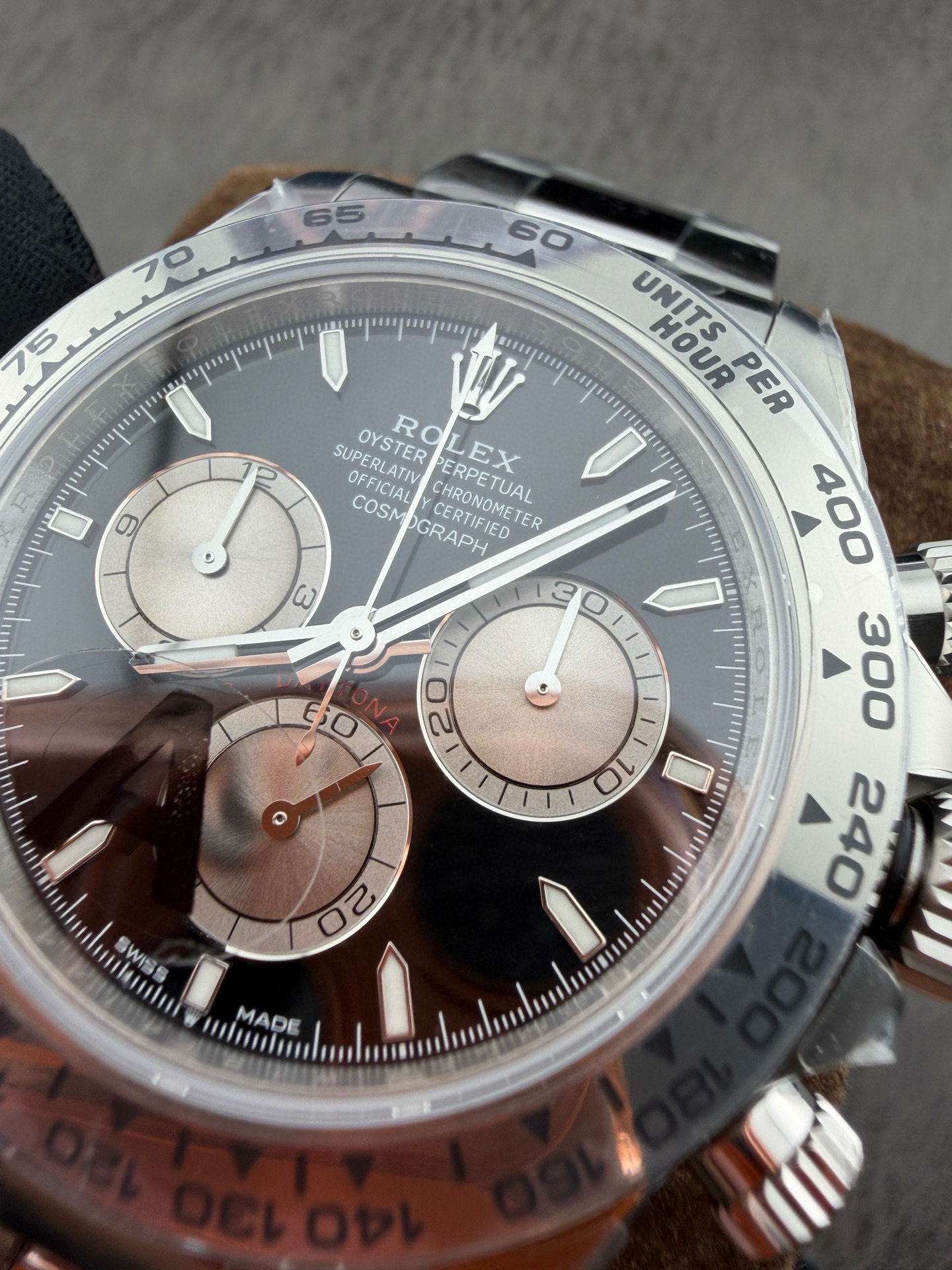 Macro view of the VSF Daytona dial center pinion, faceted hour markers, and the 6 o'clock printed coronet