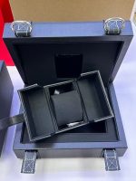 Open Omega Speedmaster watch box with removable cushion insert