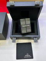 Omega Speedmaster watch box interior with cushion and polishing cloth