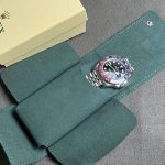 Rolex premium green watch case holding a watch