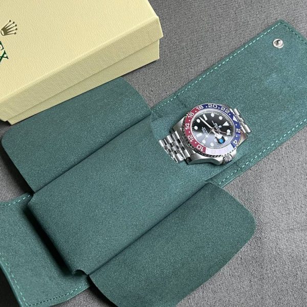 Rolex premium green watch case holding a watch